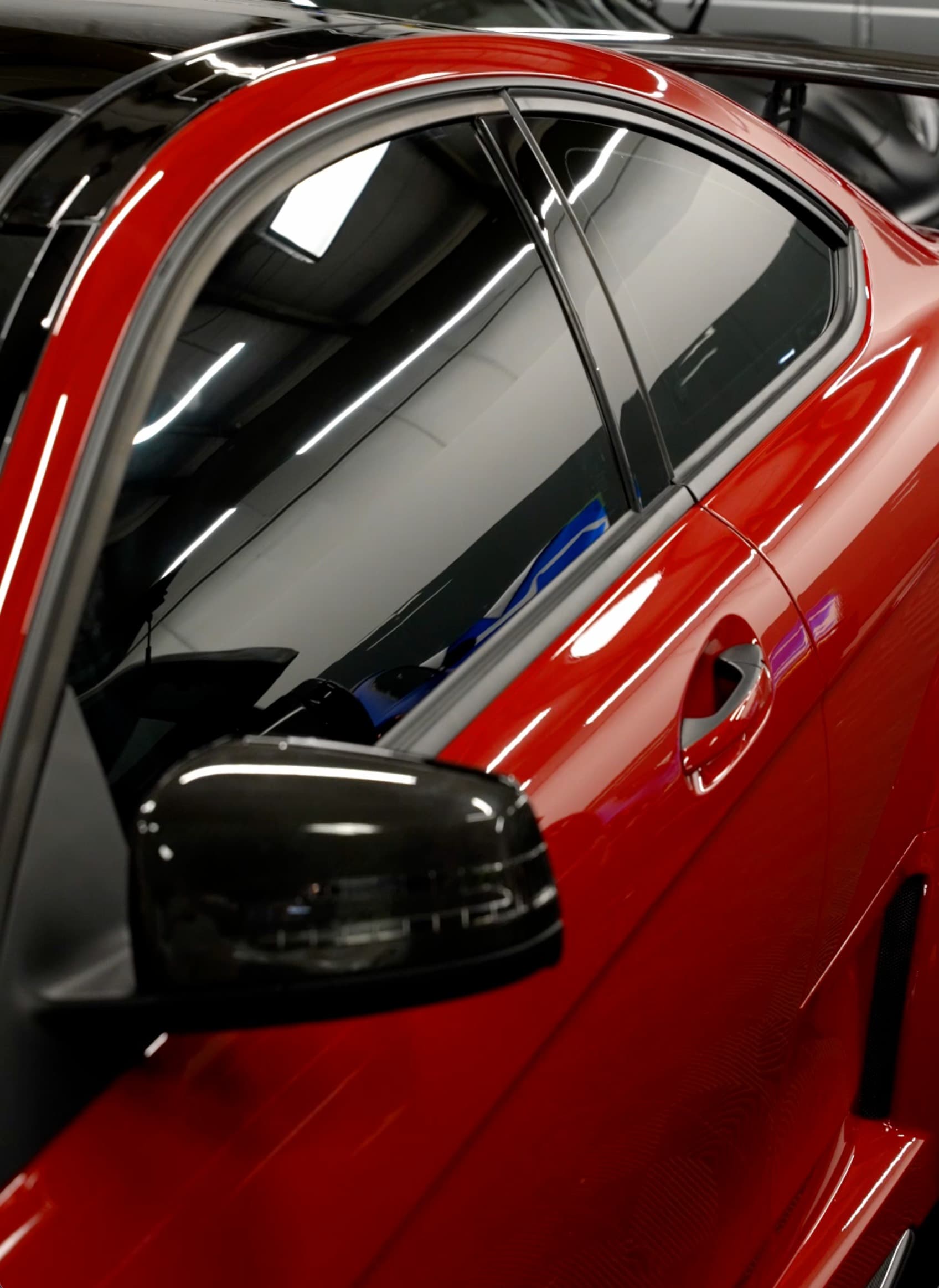 Ceramic tinted red coupe side view